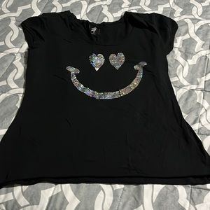 Woman’s black short sleeve shirt with silver  face in the front size xl 10.00
